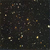 This view of nearly 10 000 galaxies was taken by the NASA/ESA Hubble Space Telescope and it is called the Hubble Ultra Deep Field. The snapshot includes galaxies of various ages, sizes, shapes, and colours. The smallest, reddest galaxies (about 100) may be among the most distant known, existing when the universe was just 800 million years old. The nearest galaxies - the larger, brighter, well-defined spirals and ellipticals - thrived about 1 thousand million years ago, when the cosmos was 13 thousand million years old.<br /><br />The image required 800 exposures taken over the course of 400 Hubble orbits around Earth. The total amount of exposure time was 11.3 days, taken between 24 September 2003 and 16 January 2004.<br /><br />Credits: NASA, ESA, S. Beckwith (STScI) and the HUDF Team